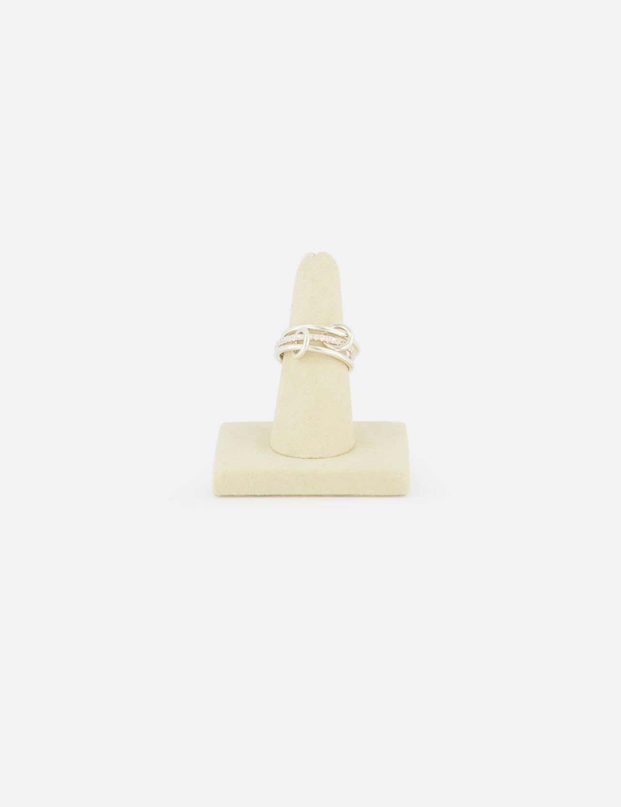 The SPINELLI KILCOLLIN Sonny Pavé Band Ring in sterling silver is shown upright on a beige ring holder, set against a plain white background.