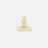 The SPINELLI KILCOLLIN Sonny Pavé Band Ring is shown upright on a beige velvet ring stand, with a plain white background.