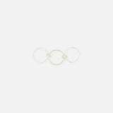 The SPINELLI KILCOLLIN Sonny Pavé Band Ring is a sterling silver piece with three connected circles, featuring a pavé diamond-encrusted center band, shown on a plain white background.