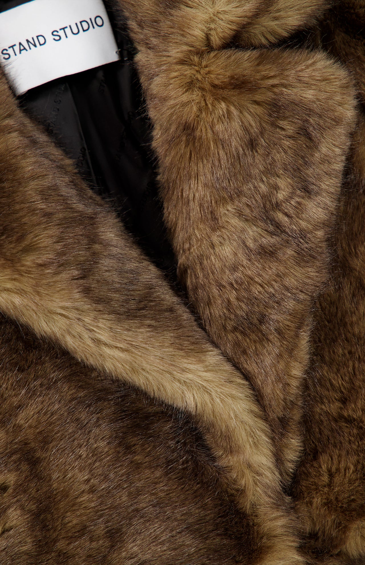 Close-up of a brown faux fur Silena Jacket with wide lapels.