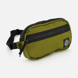The STONE ISLAND Coated Nylon Belt Bag in olive green is crafted from durable coated nylon and features a black zipper, an adjustable strap, and a circular black-and-white logo patch on the front, making it the perfect accessory to add functional streetwear style to any outfit.