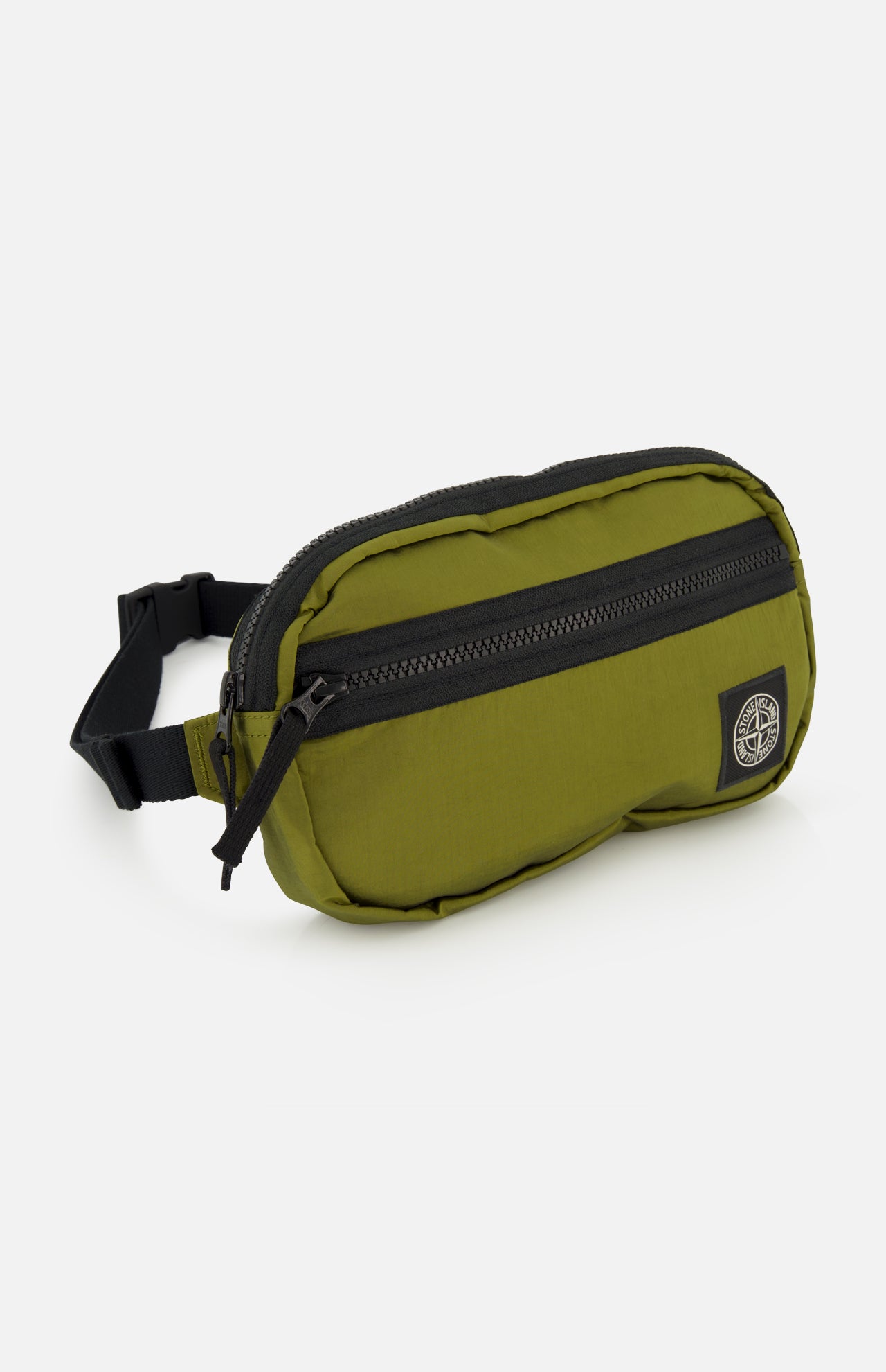 The STONE ISLAND Coated Nylon Belt Bag in olive green is crafted from durable coated nylon and features a black zipper, an adjustable strap, and a circular black-and-white logo patch on the front, making it the perfect accessory to add functional streetwear style to any outfit.