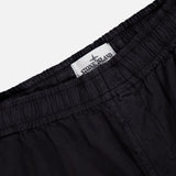 Close-up of the waistband on STONE ISLAND Drawstring Cargo Trouser Pant, featuring an elastic band and a white inside label with the brand’s logo—an essential streetwear detail.