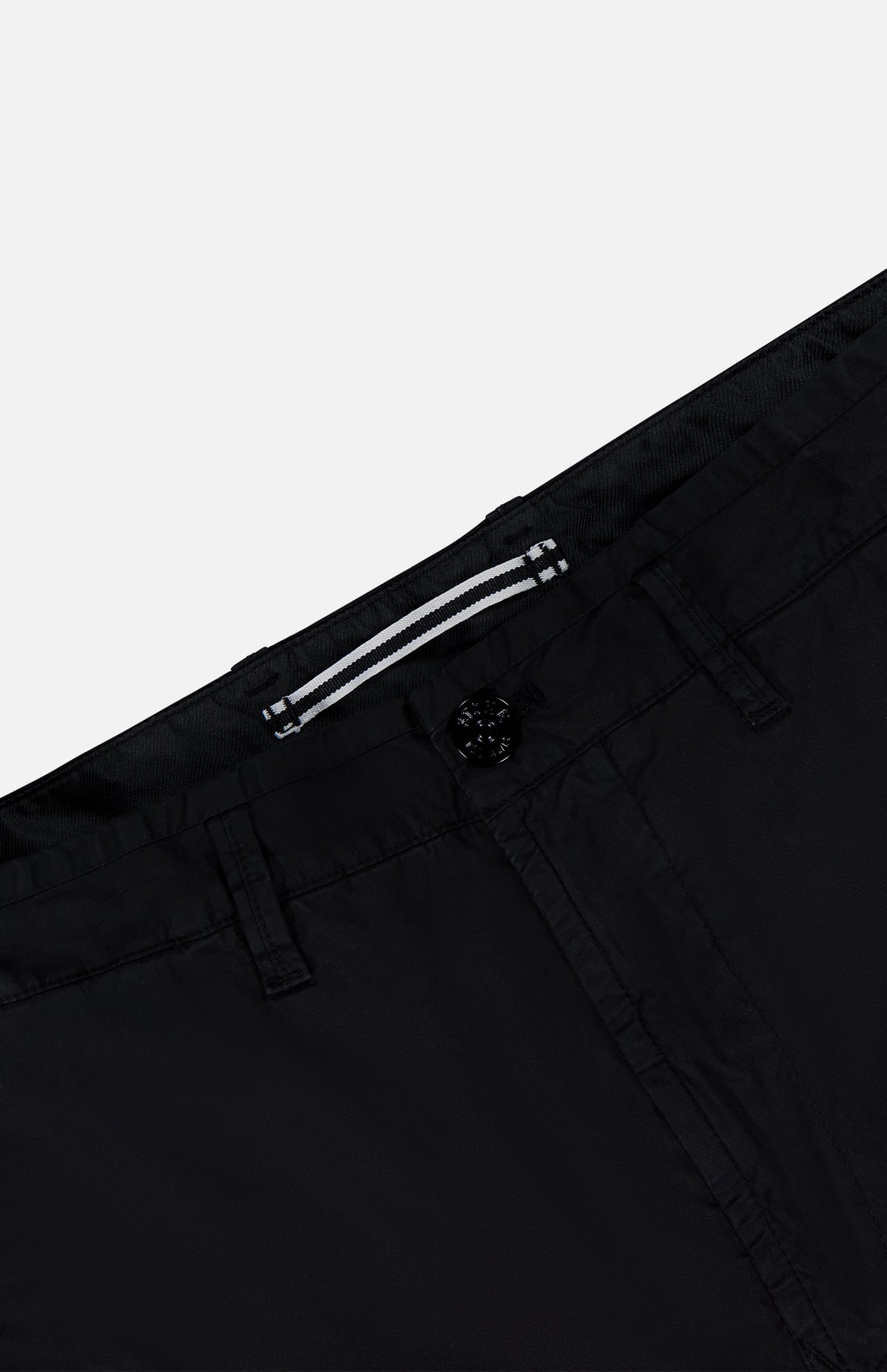 Close-up of the waistband and upper section of the STONE ISLAND Cotton Stretch Cargo Trouser Pants, showcasing a visible button, belt loops, and a white-striped tag on the inner waistband—a subtle nod to streetwear influences characteristic of Stone Island design.