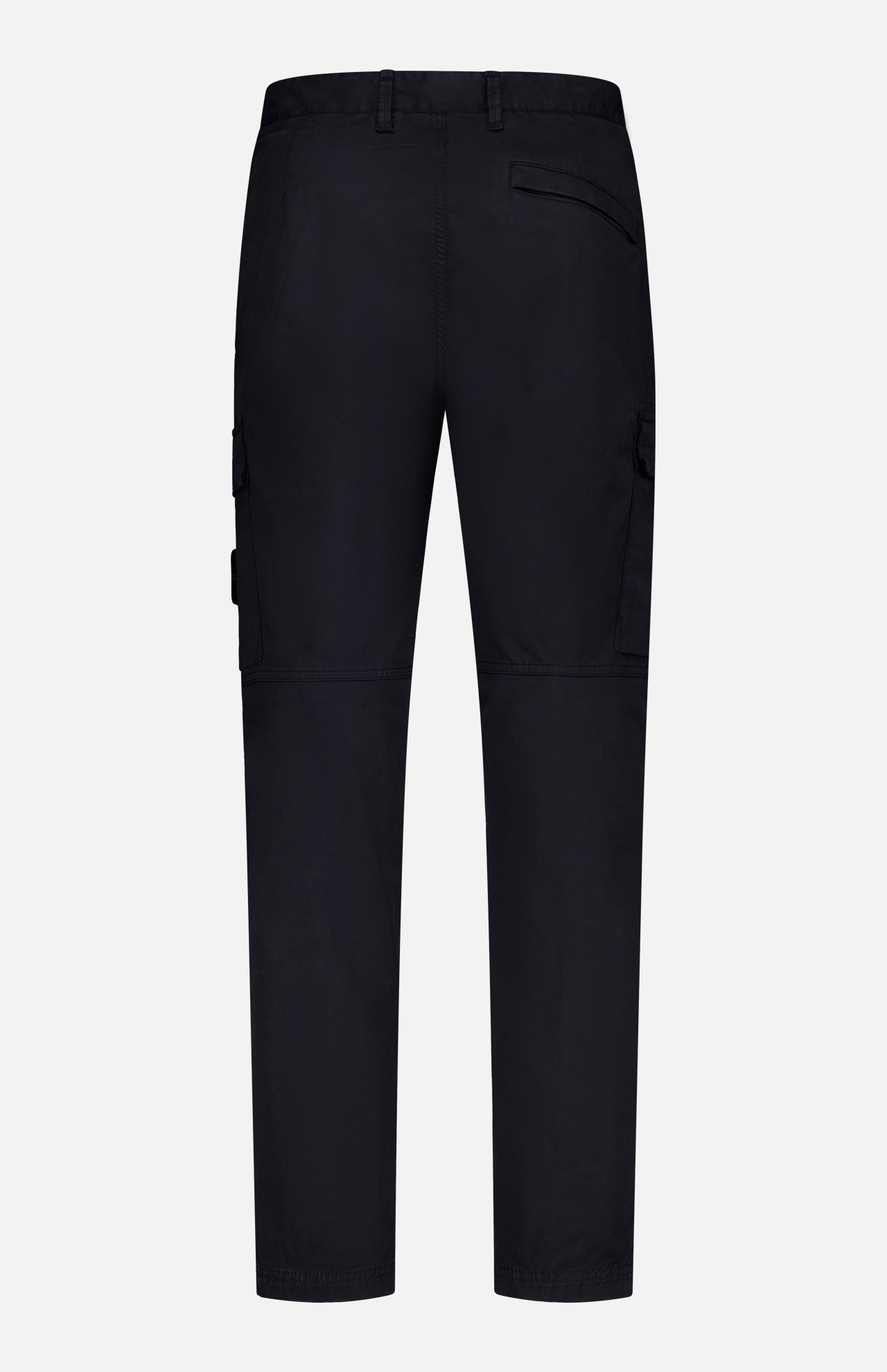 Back view of STONE ISLAND Cotton Stretch Cargo Trouser Pants in black, showcasing belt loops, flap-closure side pockets, and a single back pocket against a plain white background. These pants offer streetwear appeal with a straight-leg fit and prominent stitching details.