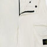 Close-up of off-white STONE ISLAND Cargo Trousers, featuring a partially open zipper, button fastening, visible waistband label, and the signature logo patch on the cargo pocket—showcasing iconic sportswear style.