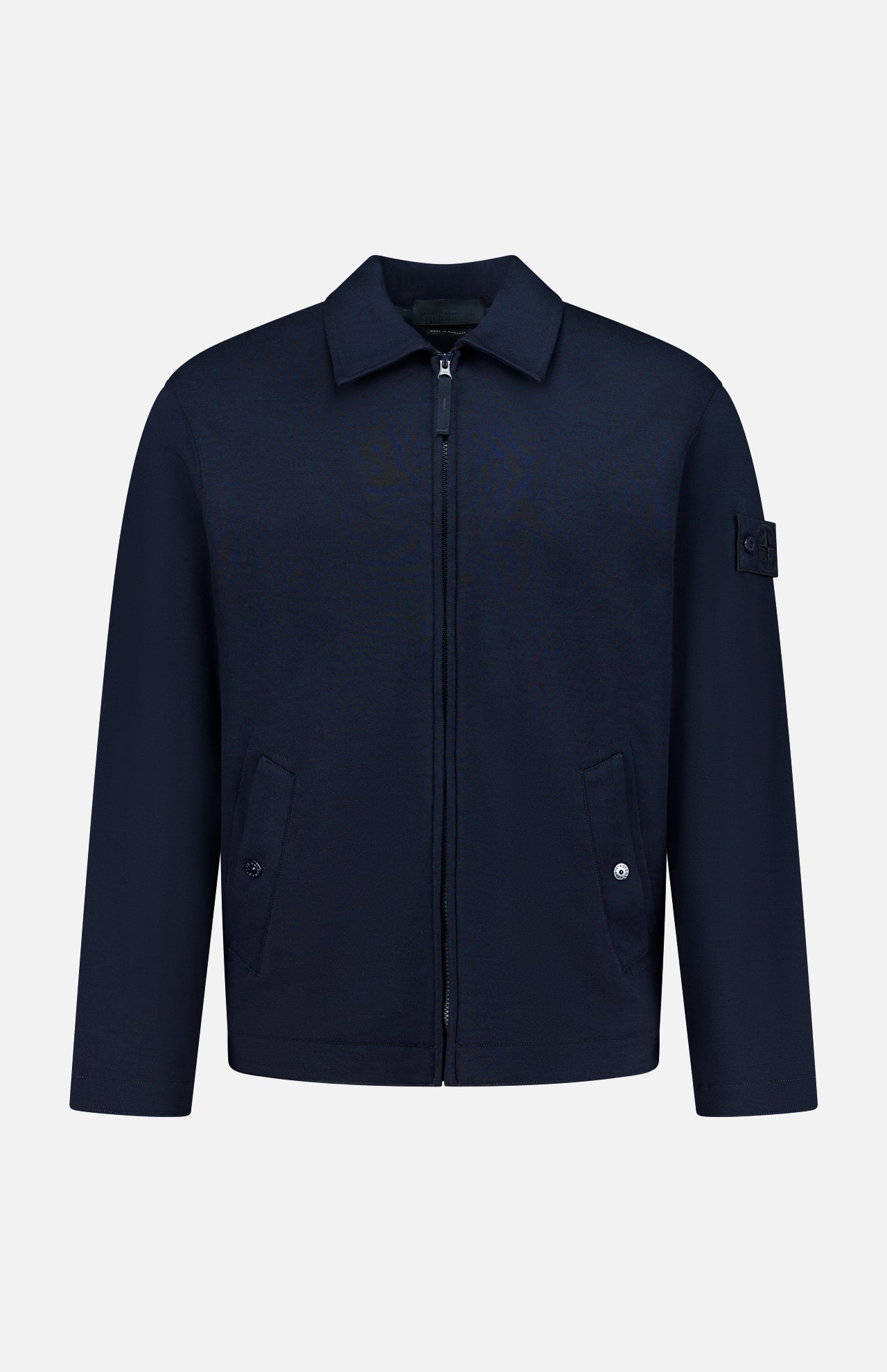 Coach Full Zip Jacket by STONE ISLAND in navy blue, featuring a zip-up front, collared neckline, two buttoned front pockets, and signature patch on the left sleeve. Crafted from a premium wool-cotton blend sportswear fabric and showcased against a plain white background.