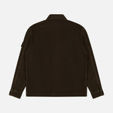 Back view of the STONE ISLAND Corduroy Chest Pocket Overshirt in dark brown, featuring long sleeves, buttoned cuffs, and a simple collar, shown against a plain white background.