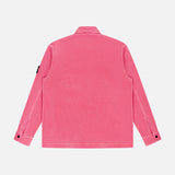 The STONE ISLAND Corduroy Chest Pocket Overshirt in bright pink is shown from the back, featuring a classic collar, long sleeves with buttoned cuffs, and an upper left sleeve patch against a plain white background.
