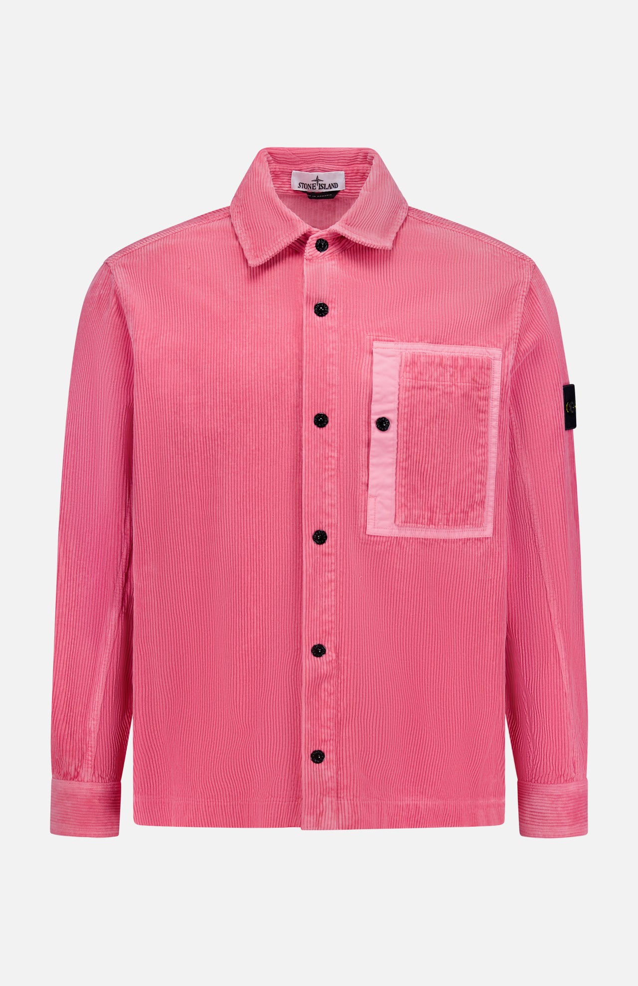 The STONE ISLAND Corduroy Chest Pocket Overshirt is a pink, long-sleeve button-up with a large chest pocket and black sleeve patch, inspired by classic overshirt style. Shown on a white background and perfect for streetwear.
