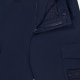STONE ISLAND Ghost Cargo Trouser Pants in navy feature a partially unzipped fly, button closure, belt loops, and side cargo pockets with a buttoned flap and stitched logo patch—perfect for men's sportswear looks.