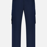 Back view of STONE ISLAND Ghost Cargo Trouser Pants in navy with belt loops, dual back flap pockets, and side cargo pockets. Stylish men's sportswear displayed against a plain white background.