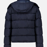 Back view of a monochromatic Stone Island Ghost Hooded Puffer Jacket with a quilted design and a detachable hood.