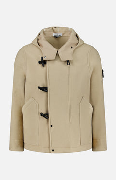 The STONE ISLAND Hooded Toggle Jacket in beige features black toggle closures, front pockets, and a high collar, displayed on a plain white background.