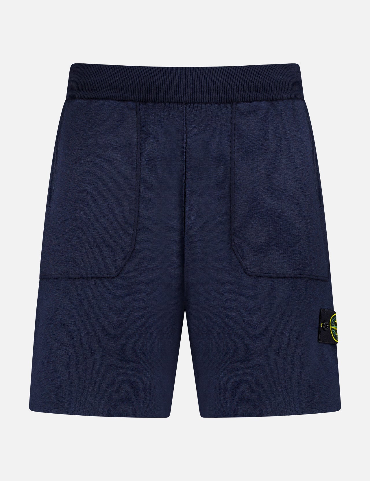 STONE ISLAND Knitwear Drawstring Shorts in navy cotton-blend feature an elastic waistband, front patch pockets, and a black and yellow logo patch on the left leg. Displayed against a plain white background.