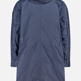 A long, navy blue Stone Island Long Waxed Coating Parka Coat is shown from the back, featuring long sleeves, a relaxed fit, and seam details across the waist and shoulders.