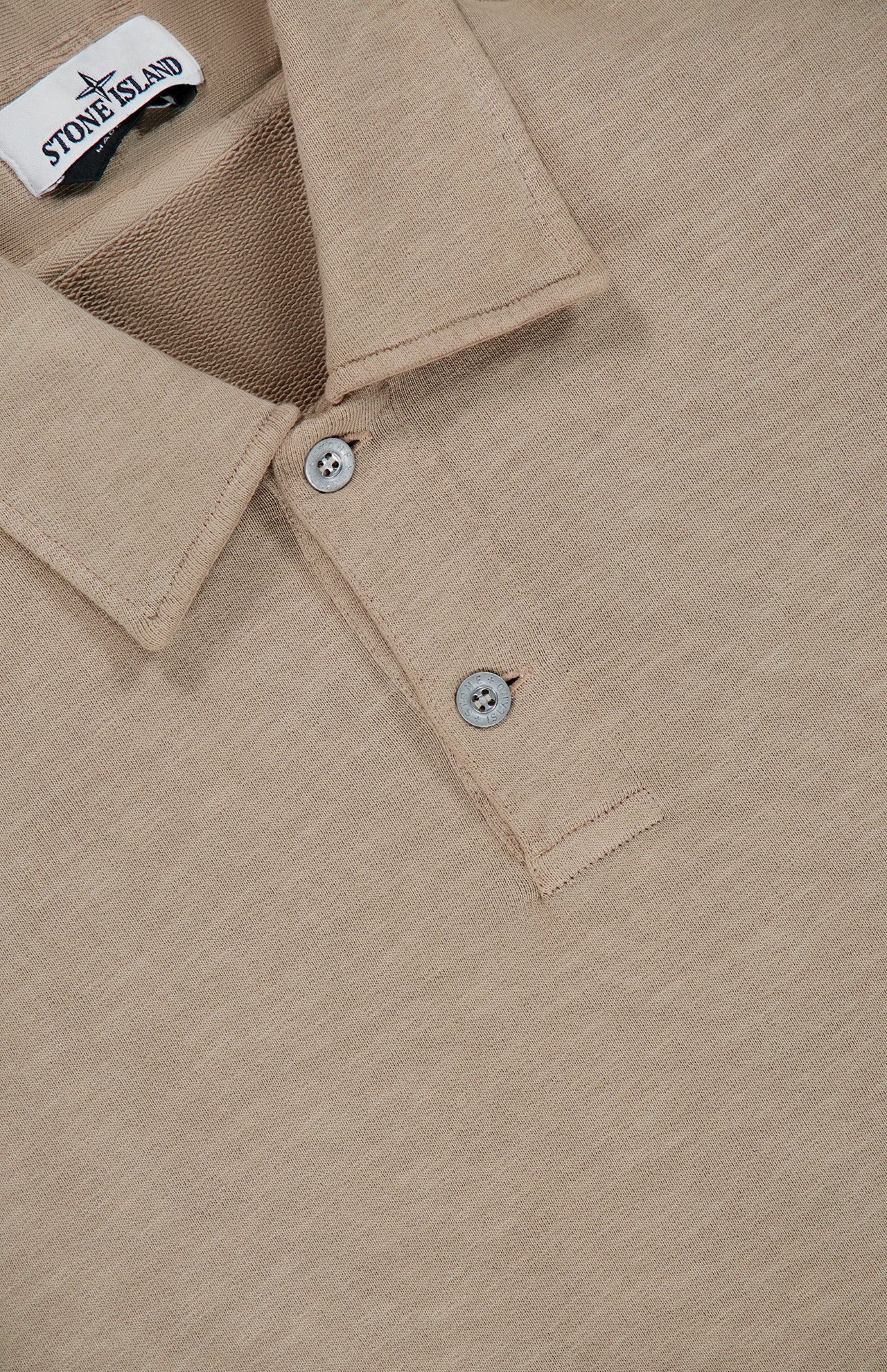 Beige Long Sleeve Polo Pullover Sweatshirt by STONE ISLAND, featuring a collared design with two buttons and the label inside the collar—a timeless sportswear classic.