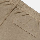 Close-up of the STONE ISLAND Loose-Fit Cargo Jogger Pant in beige, featuring an elastic waistband and a single welt back pocket, shown against a white background.