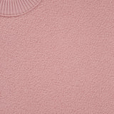 Close-up of the STONE ISLAND Maglia Crewneck Sweater in pink virgin wool, featuring a ribbed crewneck and part of the brand’s label—showcasing premium craftsmanship with modern streetwear style.