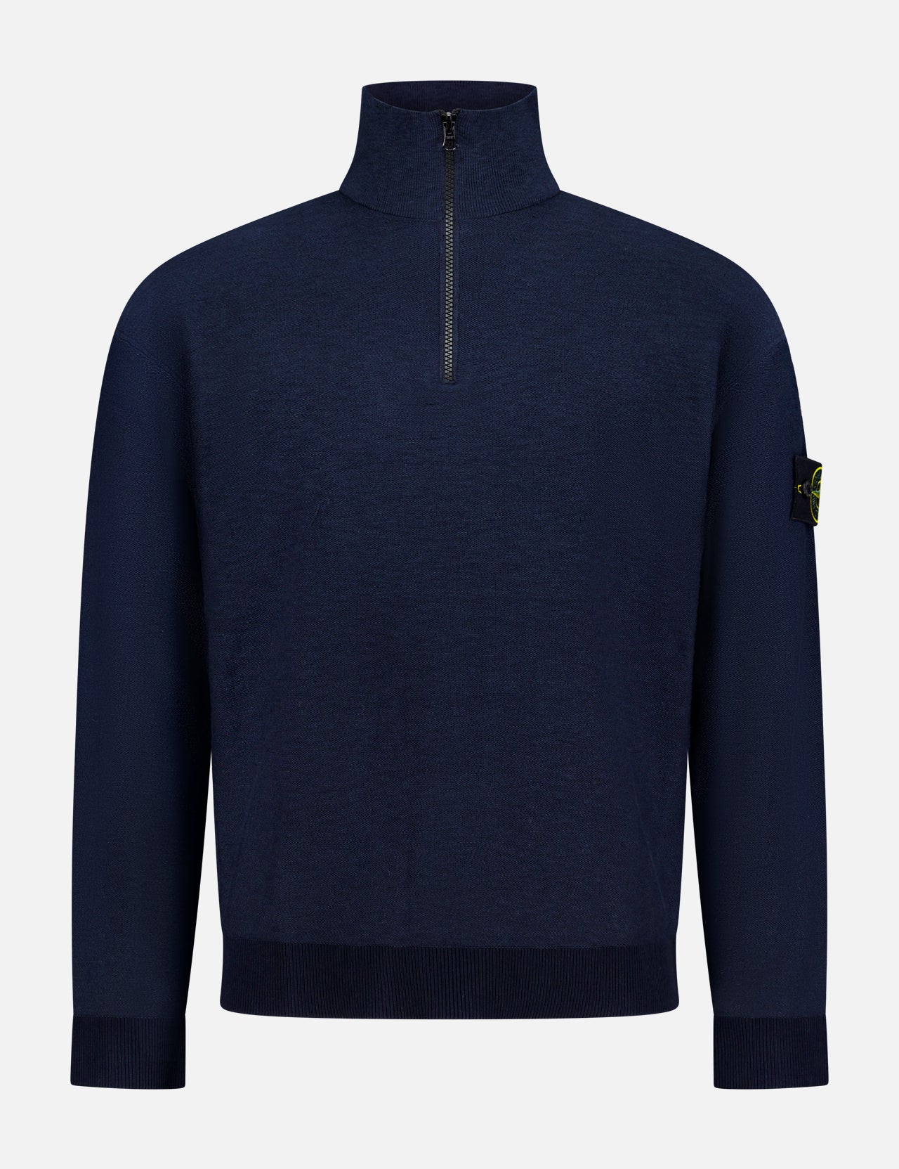 The STONE ISLAND Quarter Zip Knit Pullover in navy features long sleeves, a high collar, ribbed hem and cuffs, and a black and yellow logo patch on the upper left sleeve. Shown against a plain white background.