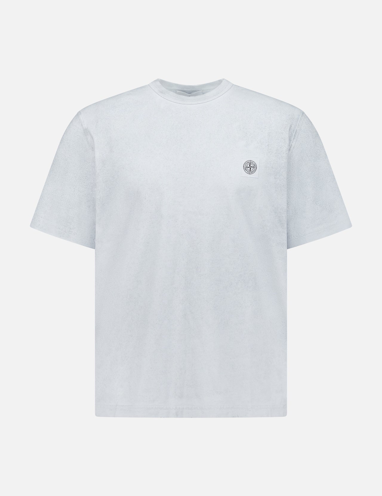 The STONE ISLAND Reflected Short Sleeve T-Shirt in light grey features a round neck and small circular chest logo—a minimalist streetwear staple, shown on a white background.