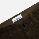 Close-up of brown STONE ISLAND Regular-Fit Corduroy Trouser Pants with a visible button, belt loops, and a white brand label inside the waistband—a standout in men's designer sportswear.