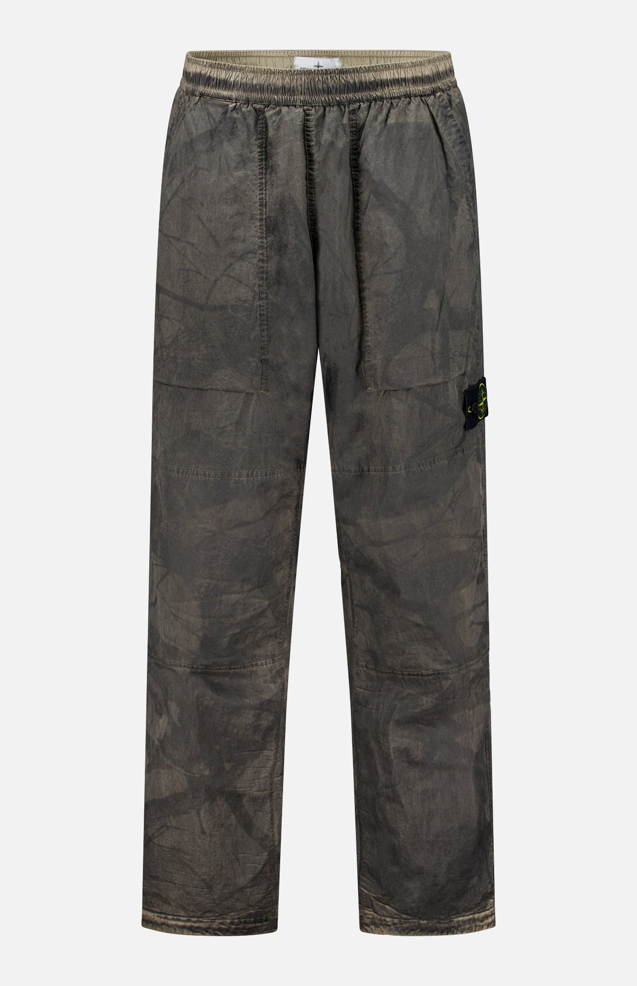 STONE ISLAND Regular-Fit Pattern Trousers in a brownish-grey shade, featuring loose fitting, an elastic waistband, side pockets, and a small black logo patch on the left leg, crafted with technical construction and shown against a plain white background.