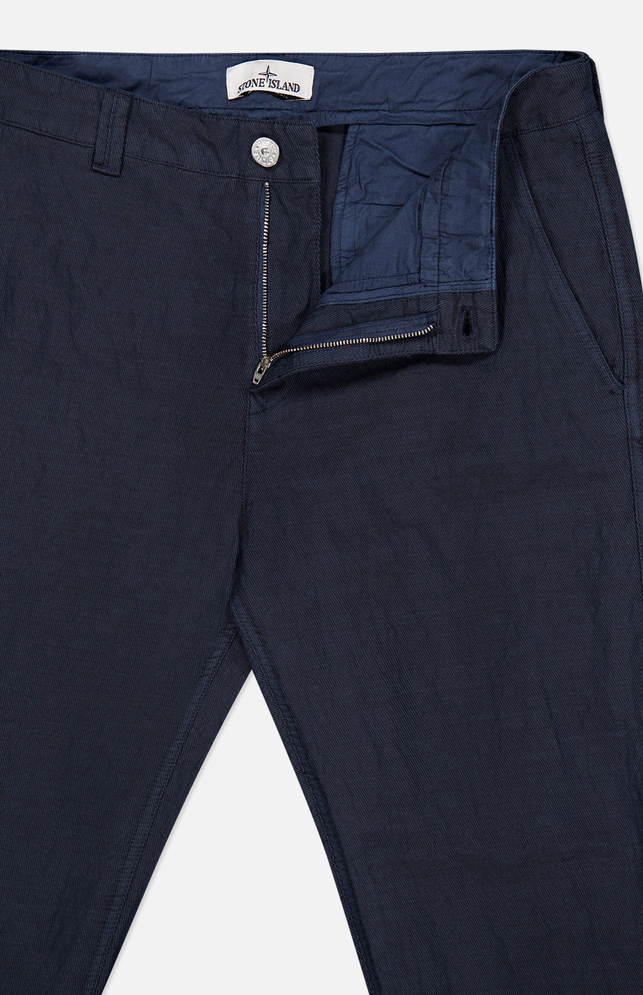 Close-up of navy blue Stone Island Regular-Fit Trousers featuring a zippered fly and button closure.
