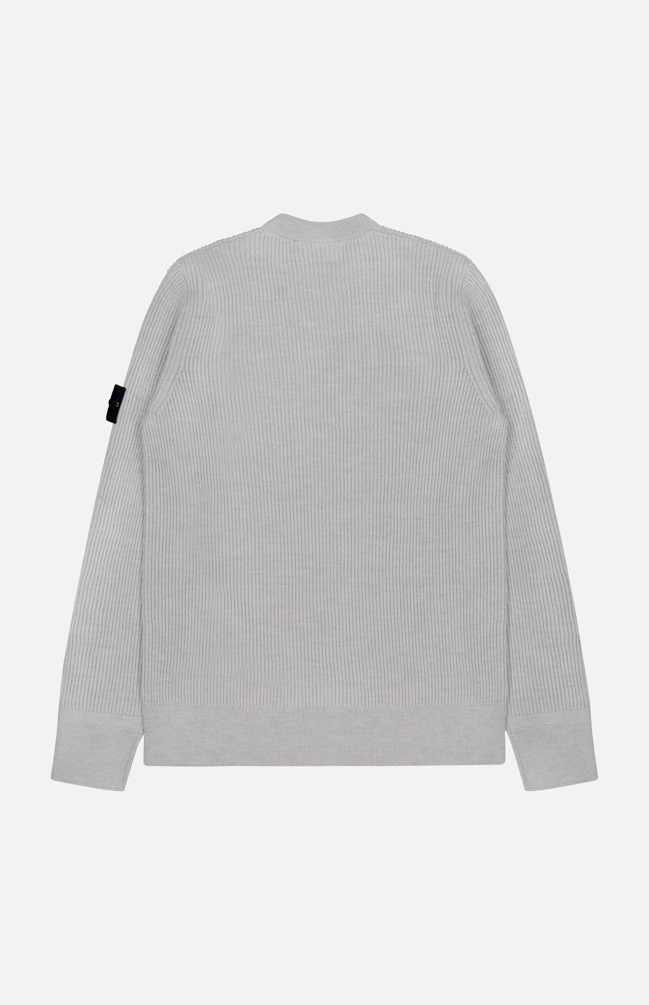 The STONE ISLAND Ribbed Crewneck Sweater is light gray with long sleeves and a black tag on the left upper sleeve. Seen from the back against a plain white background.