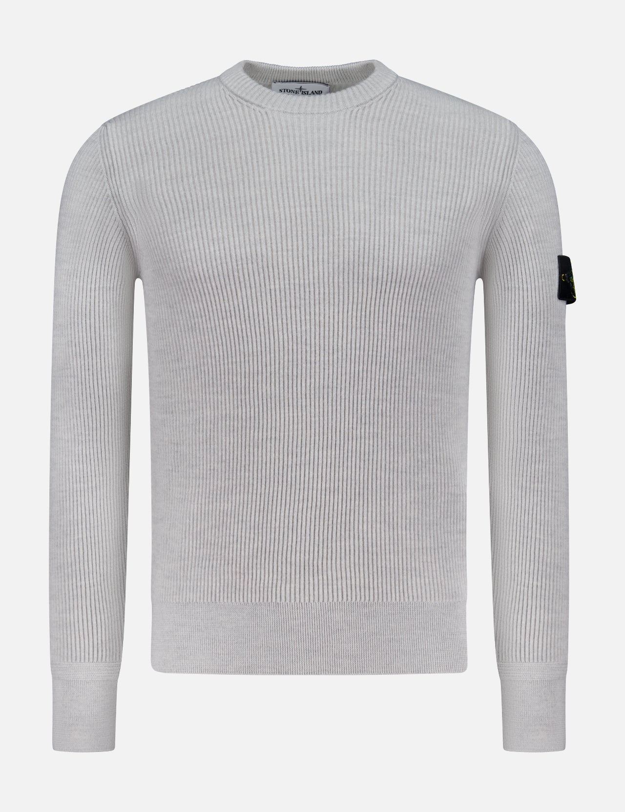 The STONE ISLAND Ribbed Crewneck Sweater in light grey features long sleeves, a ribbed knit design, and a black patch with the circular logo on the upper left sleeve. Shown on a plain white background.