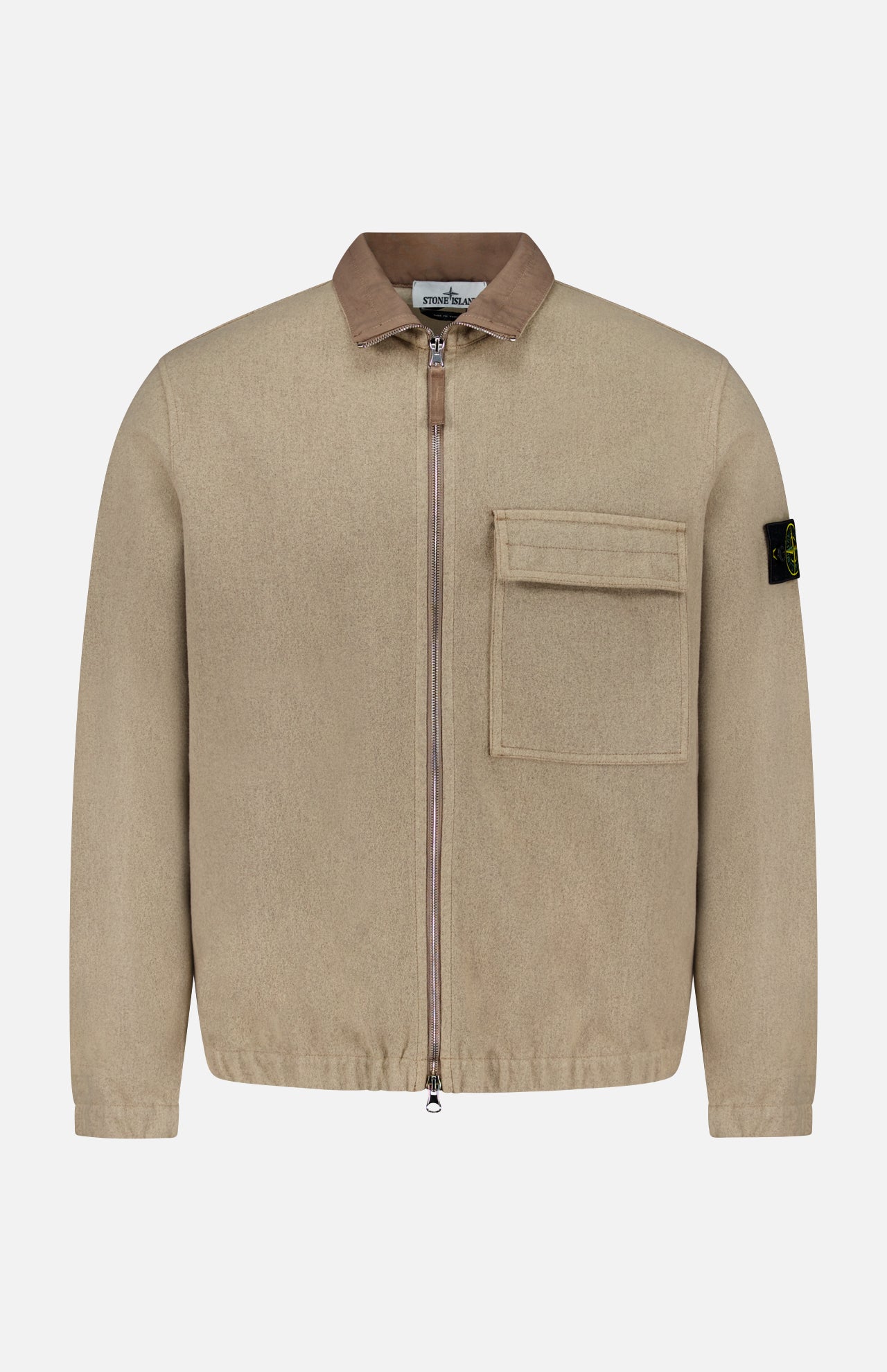Stand Collar Zip Up Jacket by STONE ISLAND in beige, featuring a brown collar, large flap chest pocket, and black logo patch on the left sleeve, displayed against a plain white background—an iconic blend of streetwear and sportswear style.
