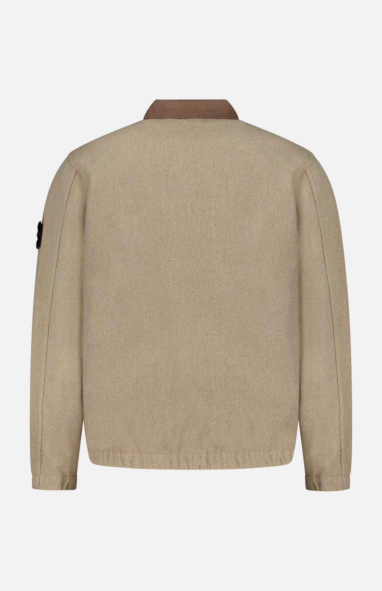 A STONE ISLAND Stand Collar Zip Up Jacket in beige is displayed from the back against a plain white background. The jacket features long sleeves, a brown collar, and a relaxed fit, with the iconic patch logo on the left sleeve that reflects contemporary streetwear style.