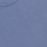 Close-up of a light blue STONE ISLAND Ribbed Knit Crewneck Sweater featuring a cotton ribbed knit design and the iconic label near the collar.