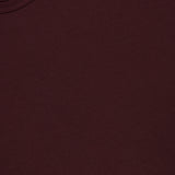A close-up of the SUNSPEL Short Sleeve Classic T-Shirt in maroon, featuring a visible collar and part of the neck tag in the upper left corner, crafted from 100% cotton for enduring comfort.