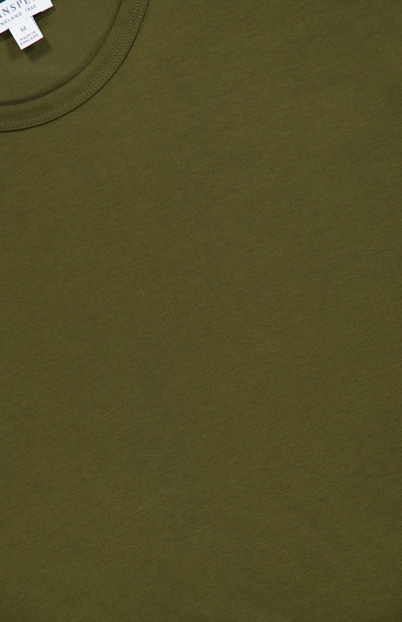 A close-up of the SUNSPEL Short Sleeve Classic T-Shirt in olive green, crafted from 100% cotton, highlighting the collar and finely stitched neckline. The soft, smooth fabric is showcased, and a small white tag with text is visible near the top left corner.