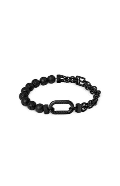 The Catena Isaac Bracelet by TATEOSSIAN features round volcanic lava beads on one side and a chain link stainless steel design on the other, connected by a textured, oval-shaped centerpiece.