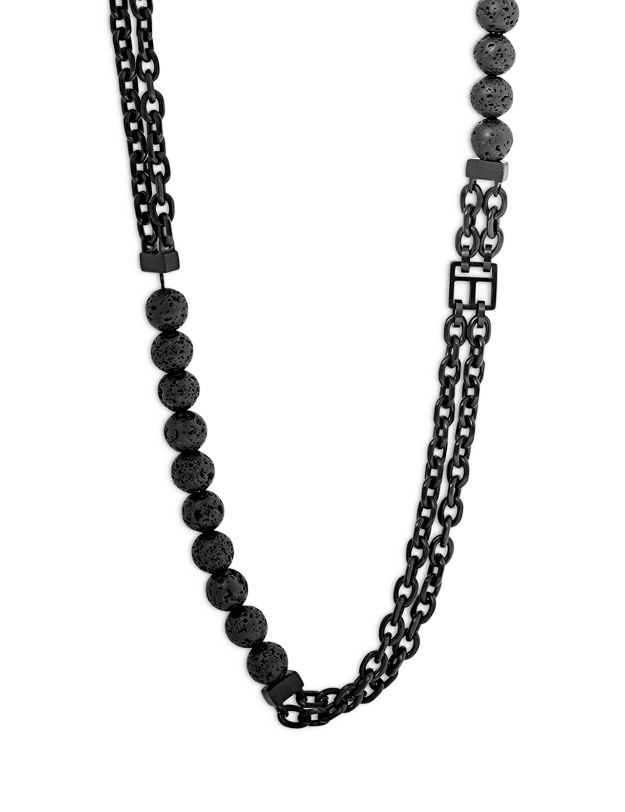 The TATEOSSIAN Catena Isaac Necklace is a black layered piece with round textured volcanic lava beads and dual chain links, partially visible against a white background.