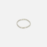 The TATEOSSIAN Bici Chain Bracelet features a sleek box link design in polished silver, displayed on a white background. This modern accessory exudes understated luxury and is ideal for elevating any style.