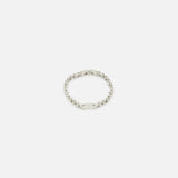 The TATEOSSIAN Bici Chain Bracelet features a rectangular, textured plate on a silver stainless steel chain, shown on a plain white background.