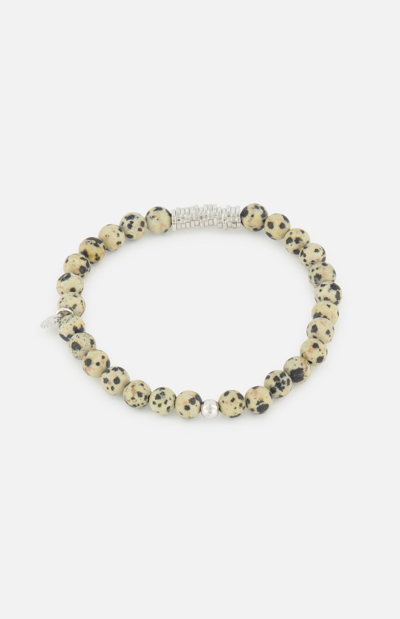 The TATEOSSIAN Classic Discs Dalmatian Jasper Bracelet features round, cream beads with black spots and a silver accent, elegantly arranged in a circle and displayed on a white background.