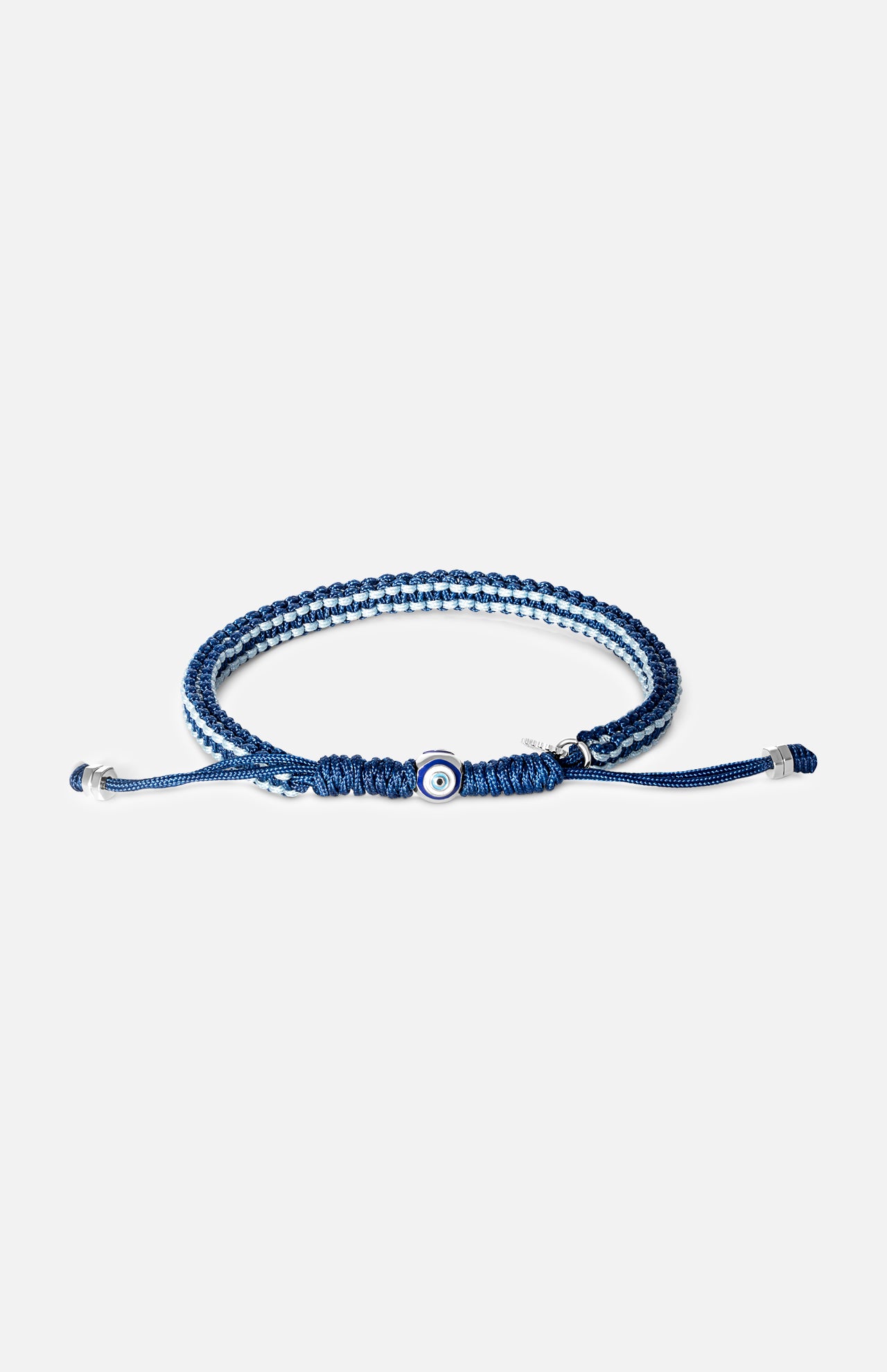 A blue and white Tateossian Evil Eye Macrame Bracelet featuring a central evil eye bead and adjustable silver-toned metal tips.