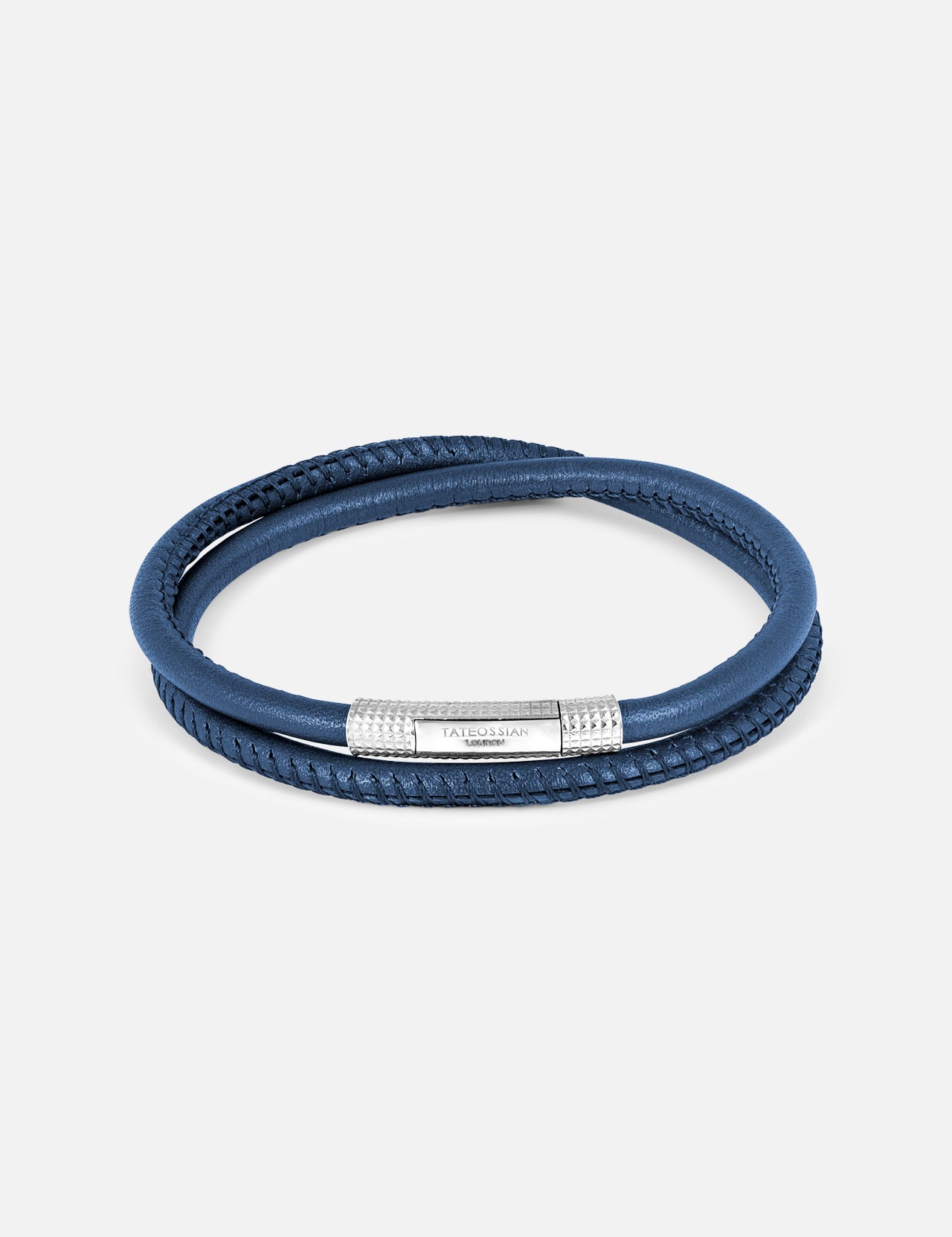 The TATEOSSIAN Giza Click Stitch Pelle bracelet is a luxury double-wrap navy leather accessory with a textured sterling silver clasp, elegantly presented on a plain light background.