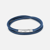 The TATEOSSIAN Giza Click Stitch Pelle Bracelet is a navy leather double-wrap, made in London, with a textured sterling silver clasp detail, shown against a plain light background.