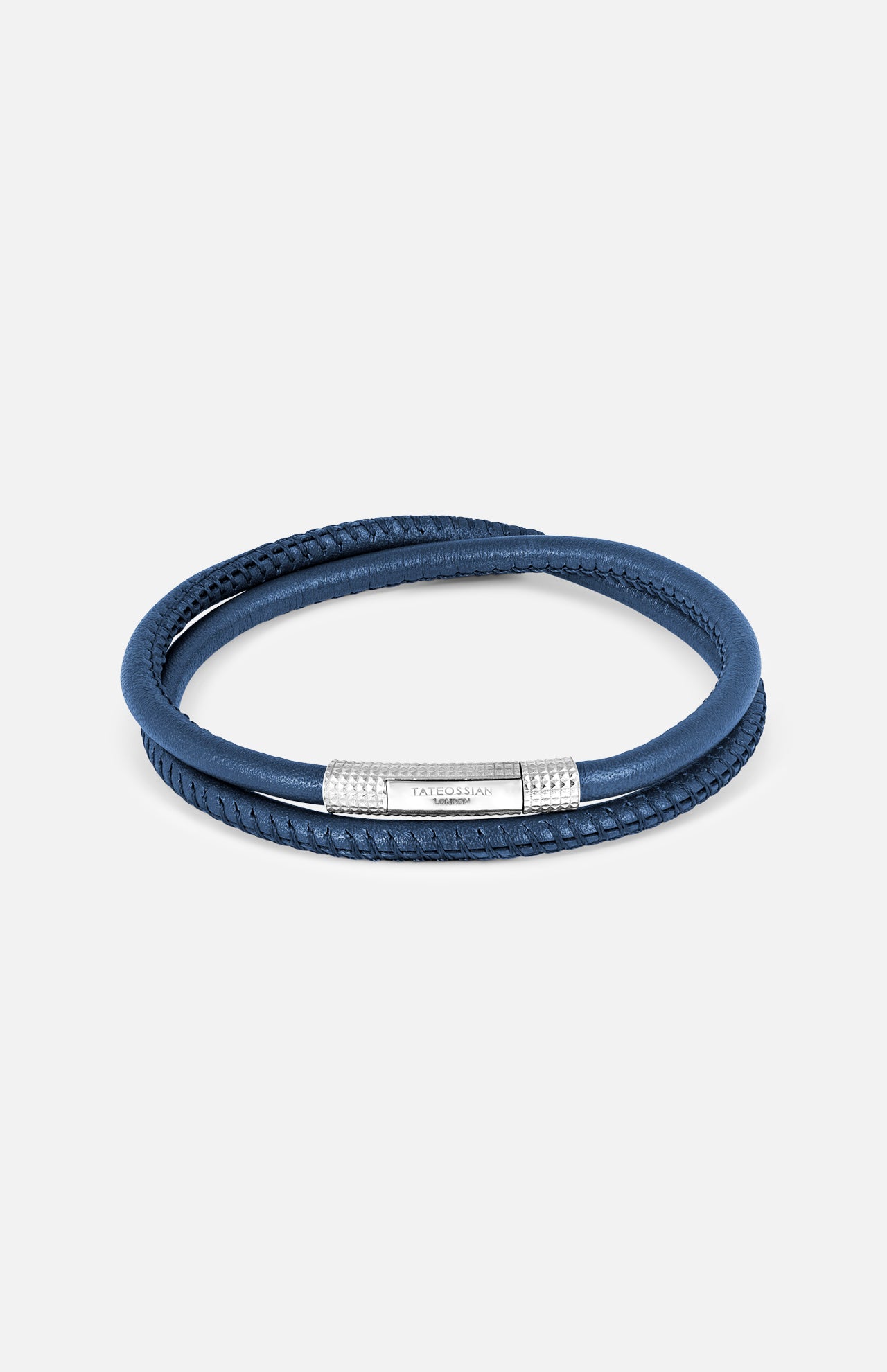 The TATEOSSIAN Giza Click Stitch Pelle Bracelet is a navy leather double-wrap, made in London, with a textured sterling silver clasp detail, shown against a plain light background.