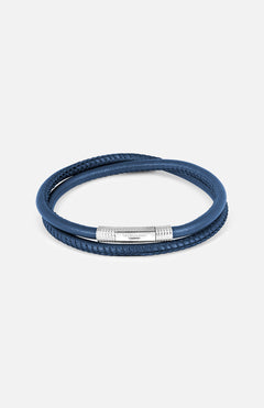 The TATEOSSIAN Giza Click Stitch Pelle Bracelet is a navy leather double-wrap, made in London, with a textured sterling silver clasp detail, shown against a plain light background.