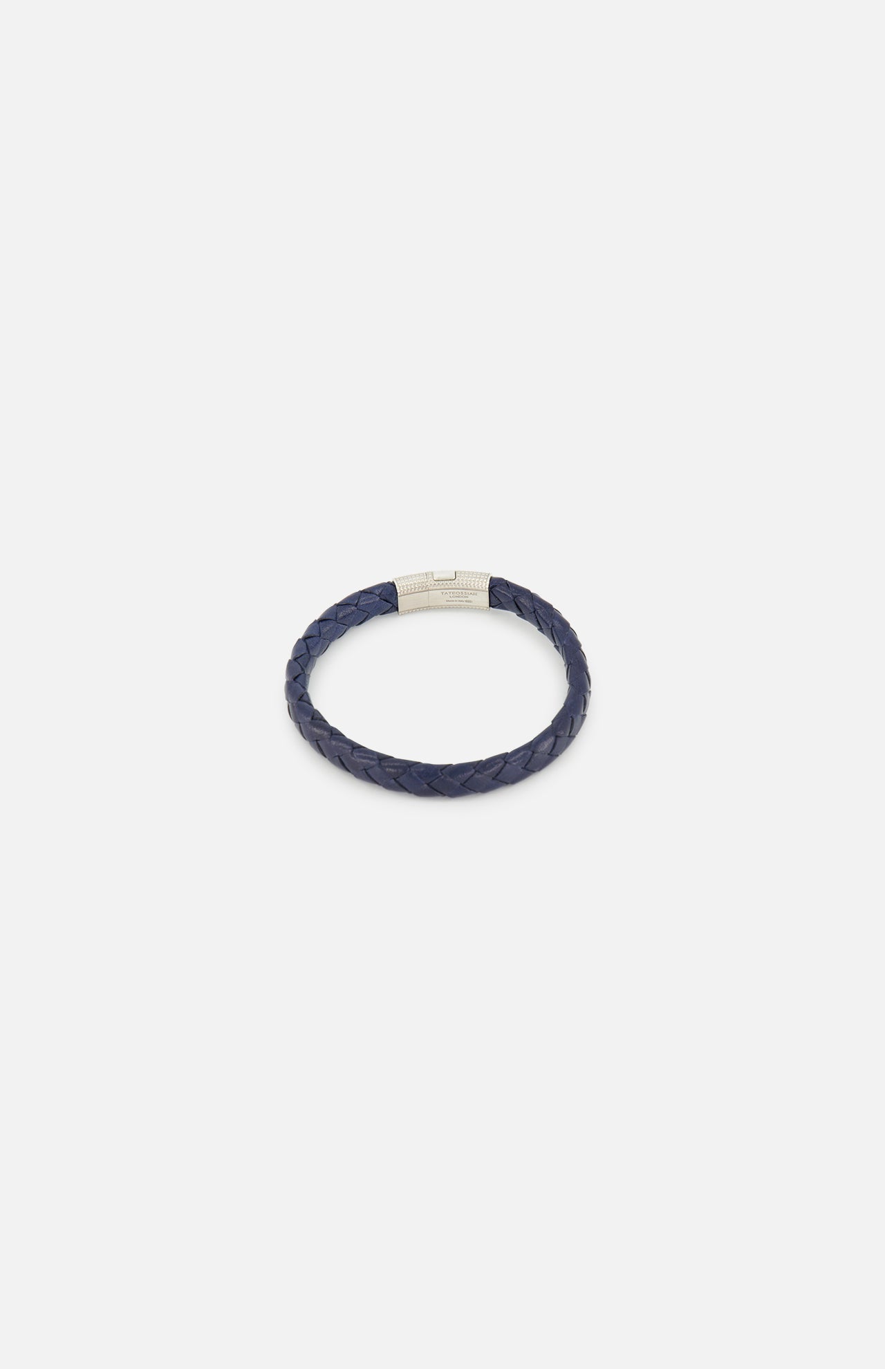 The TATEOSSIAN Giza Double Click Pelle Bracelet, featuring navy braided leather and a sterling silver cylindrical clasp, is displayed on a plain white background.