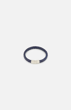 The TATEOSSIAN Giza Double Click Pelle Bracelet, featuring navy braided leather and a sterling silver cylindrical clasp, is displayed on a plain white background.
