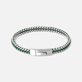The TATEOSSIAN Tris Button Bracelet features a silver and green braided design with a sleek metallic clasp, shown on a white background—a perfect men's accessory for stylish everyday wear.