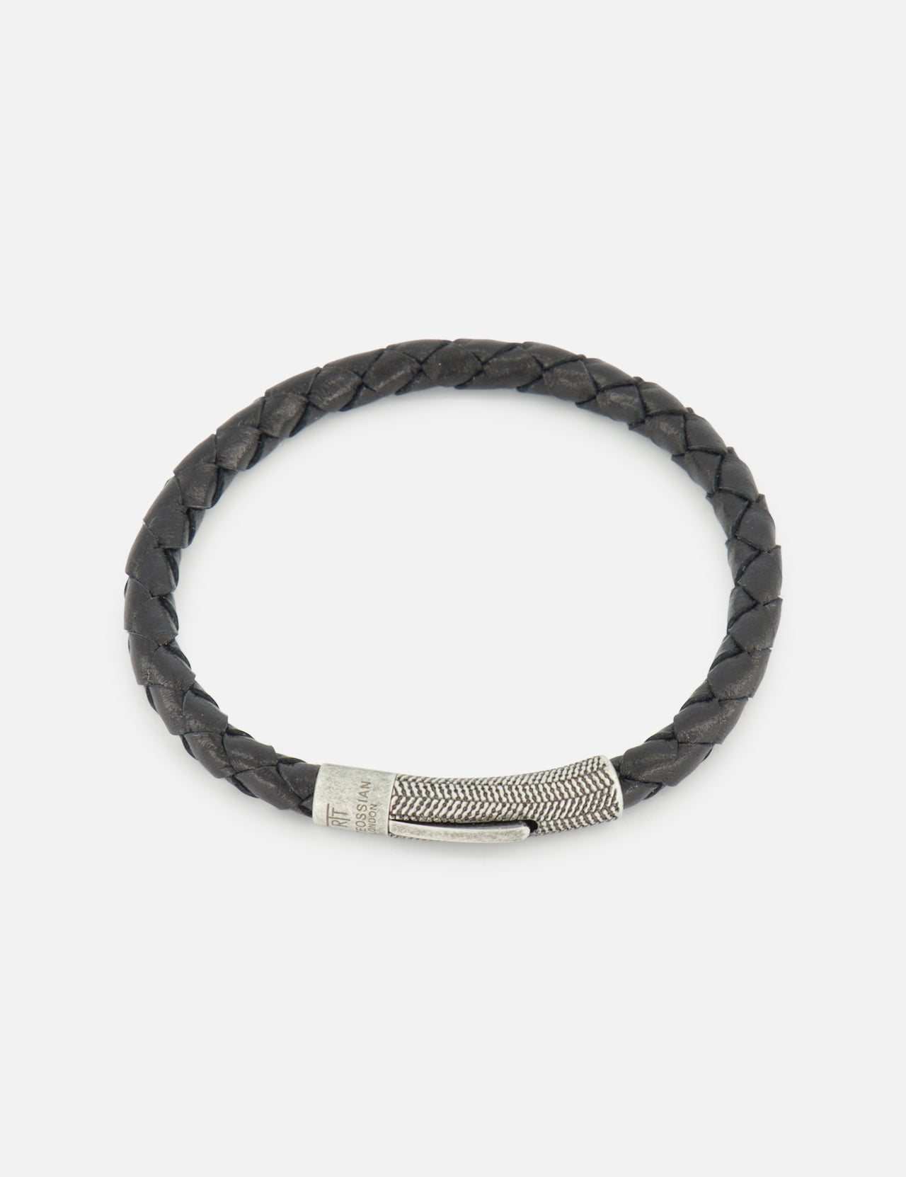 The TATEOSSIAN Vintage Herringbone Click Bracelet is a men’s luxury accessory with black braided leather and a textured stainless steel clasp, showcased elegantly on a plain white background.