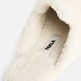 Off-white shearling TEKLA Shearling Slippers featuring a branded fabric label on the cushioned footbed.